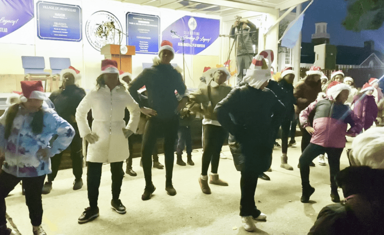 Song and dance warm hearts at Hempstead Village tree, menorah lighting